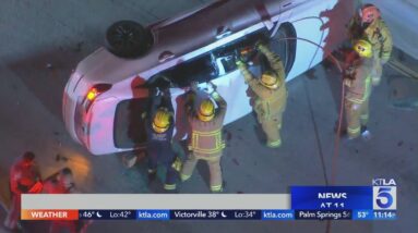 Firefighters extricate pair trapped after downtown L.A. crash