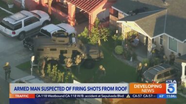 Man in custody after allegedly firing shots from Walnut Park rooftop
