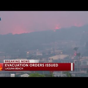 Orange County wildfire pushed by Santa Ana winds burns near coastal homes