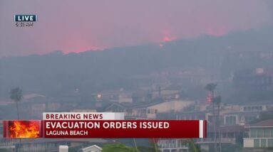 Orange County wildfire pushed by Santa Ana winds burns near coastal homes