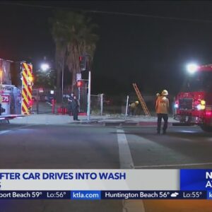 Car crashes into wash in Mission Hills