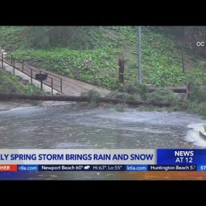 Spring storm brings rain, snow and evacuations
