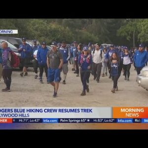 Diehard Dodgers fans hike to Hollywood Sign