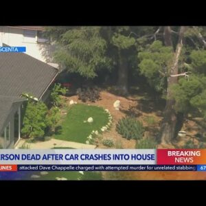1 dead after car crashes into home