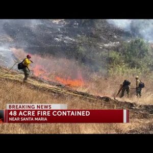 Firefighters work to put out vegetation fire on Highway 166 east of Santa Maria