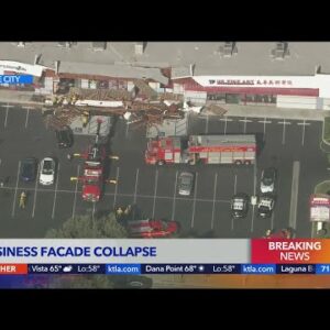 Strip mall front collapses, trapping 6