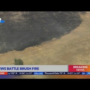 Brush fire burns in Sylmar