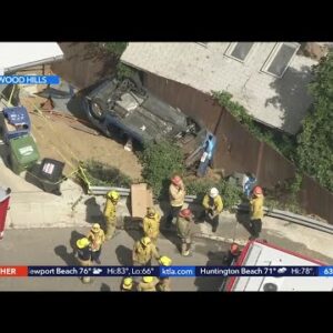 1 rescued after car falls down Hollywood Hills embankment, lands near home