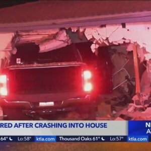 Pickup crashes into Orange home
