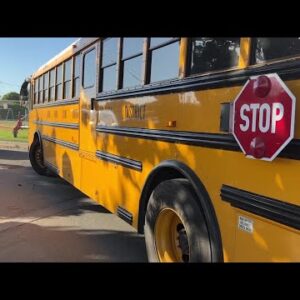School bus carrying two kids knicks car in Santa Maria