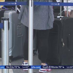 Busy travel weekend begins with delays, cancellations