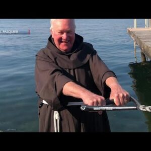 Fr. Larry Gosselin gives water skiing a try in his Franciscan habit