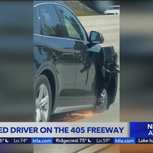 Motorists on 405 Freeway drives on 3 wheels
