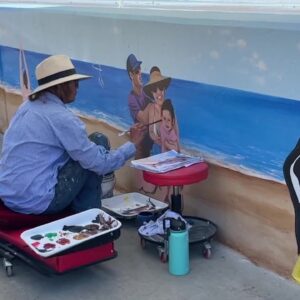Mural artist Lisa Kelly transforms seawall near Solimar into work of art