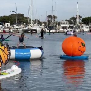 Witches trade brooms for paddles in Ventura Harbor