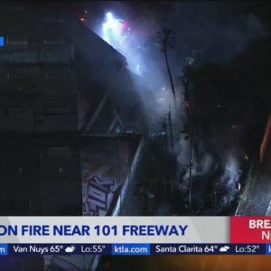 Crews battle brush fire off 101 Freeway