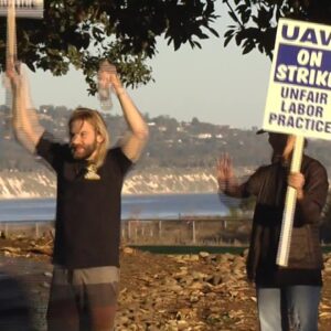 Academic workers refuse to put down their picket signs on day two of strike