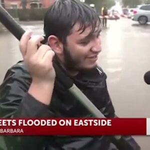California Storm: Man goes canoeing along flooded street in Santa Barbara