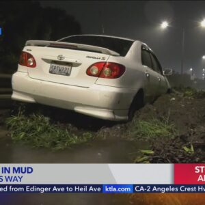 Cars trapped by rain-fueled mudslides in Baldwin Hills