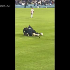 Dodgers fan pummeled after running onto field to propose