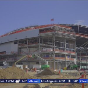 Final steel beam of Intuit Dome set in place