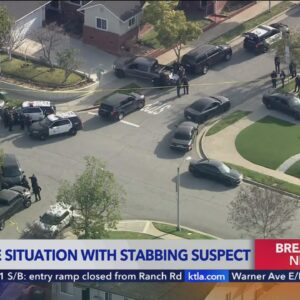 Police surround home of suspect in fatal stabbing of honors student