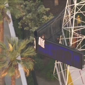 Man climbs KTLA radio tower holding ‘Free Billie Eilish’ sign in Los Angeles