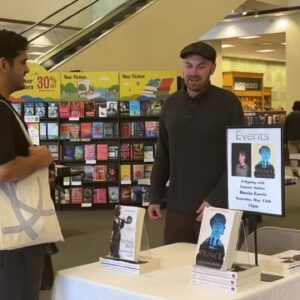 Barnes & Noble employee signs his own books at Ventura store