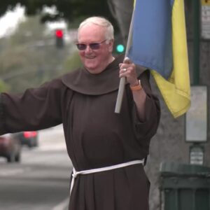 Father Larry with Ukrainian flag