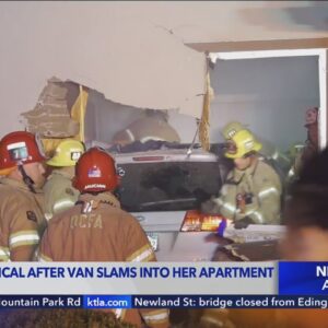 Woman in critical condition after van slams into apartment