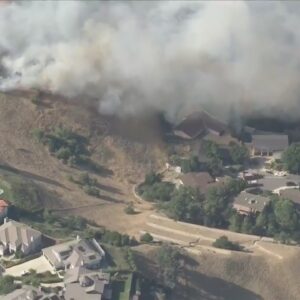 Brush fire threatens home in Los Angeles County