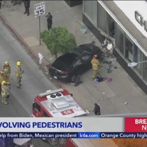 Driver hops curb, hits pedestrians and crashes into Chase Bank building