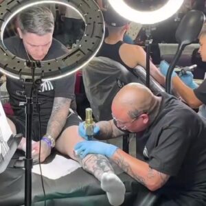 Seaside Tattoo Show includes tattoo artists at work