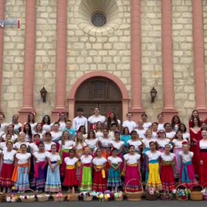 Fiesta Flower girls post for annual photo on steps of Old Mission Santa Barbara