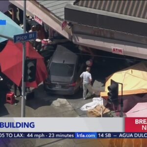 2 car crash ends with one vehicle inside downtown L.A. building