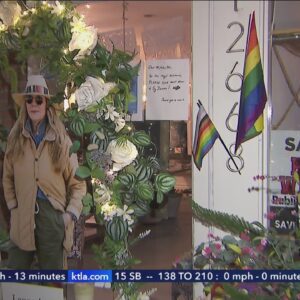Community mourns store owner killed over pride flag