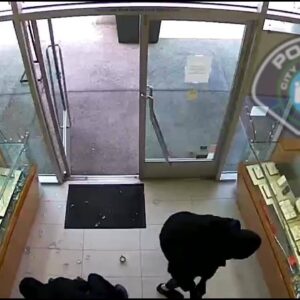Video shows masked robbers smash their way through Irvine jewelry store