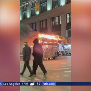 Passersby ignore burning hot dog stand in New York City