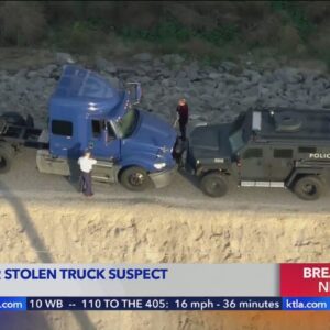 Stolen big rig driver on the run after ramming police vehicle, authorities say