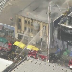 Fire crews battle raging structure fire in downtown L.A