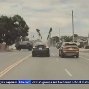 Video captures BMW run stop sign, cause multi-car crash in South L.A.