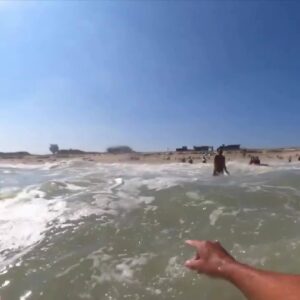 Video shows swimmer rescued from potentially deadly rip current