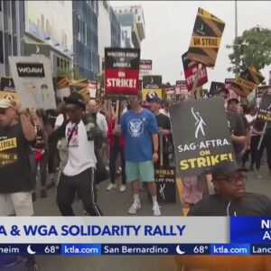 Writes and actors march through Hollywood as strikes continue