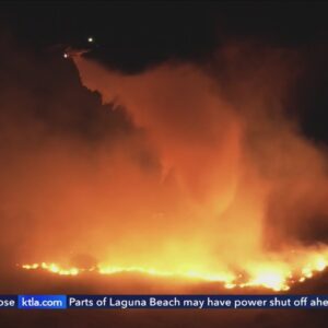 Fire crews work to contain overnight brush fire in San Fernando Valley amid Santa Ana winds 