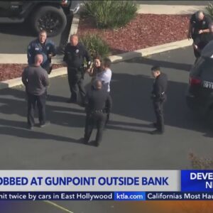 Woman robbed outside bank in Northridge