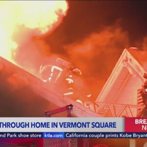 Video: Fire crews scramble to safety as fireball bursts through roof of home