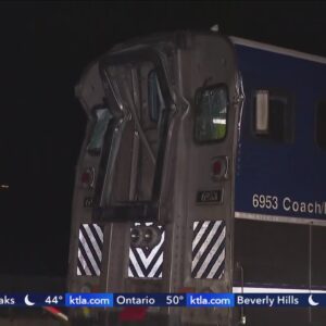 5 hospitalized after crash between train and semi-truck