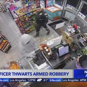 Video captures officer walking into 7-Eleven during armed robbery