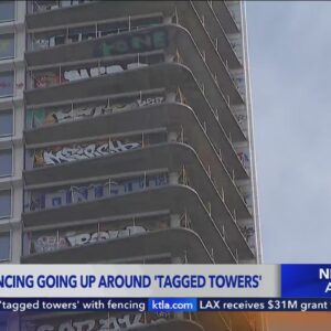 Crews begin to surround 'tagged towers' with fencing in downtown L.A.