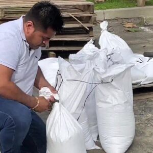 Volunteers help with sand bagging in Montecito